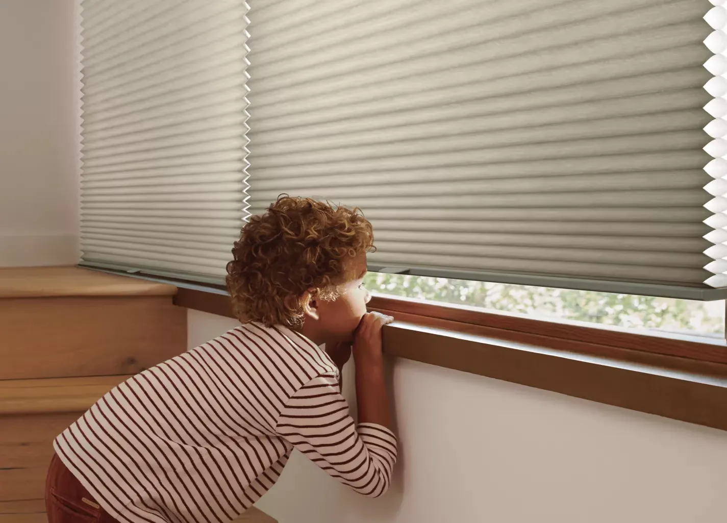 Boy looking under closed blinds | Yetzer